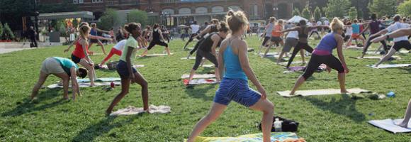 Several people participating in yoga class
